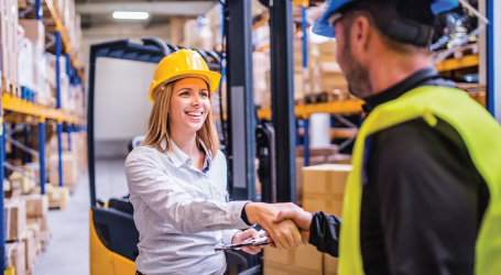 End-to-End Services -People in Warehouse Shaking Hands