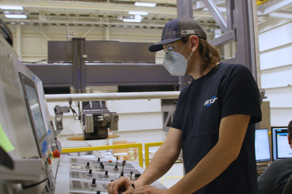 Employee reviewing nuclear power plant performance data